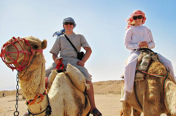 Sunset camel ride in Agadir desert.