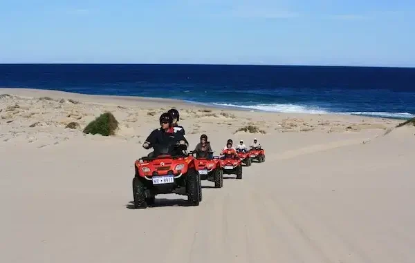 Exploring the dunes of Tamraght on a quad bike during a guided tour