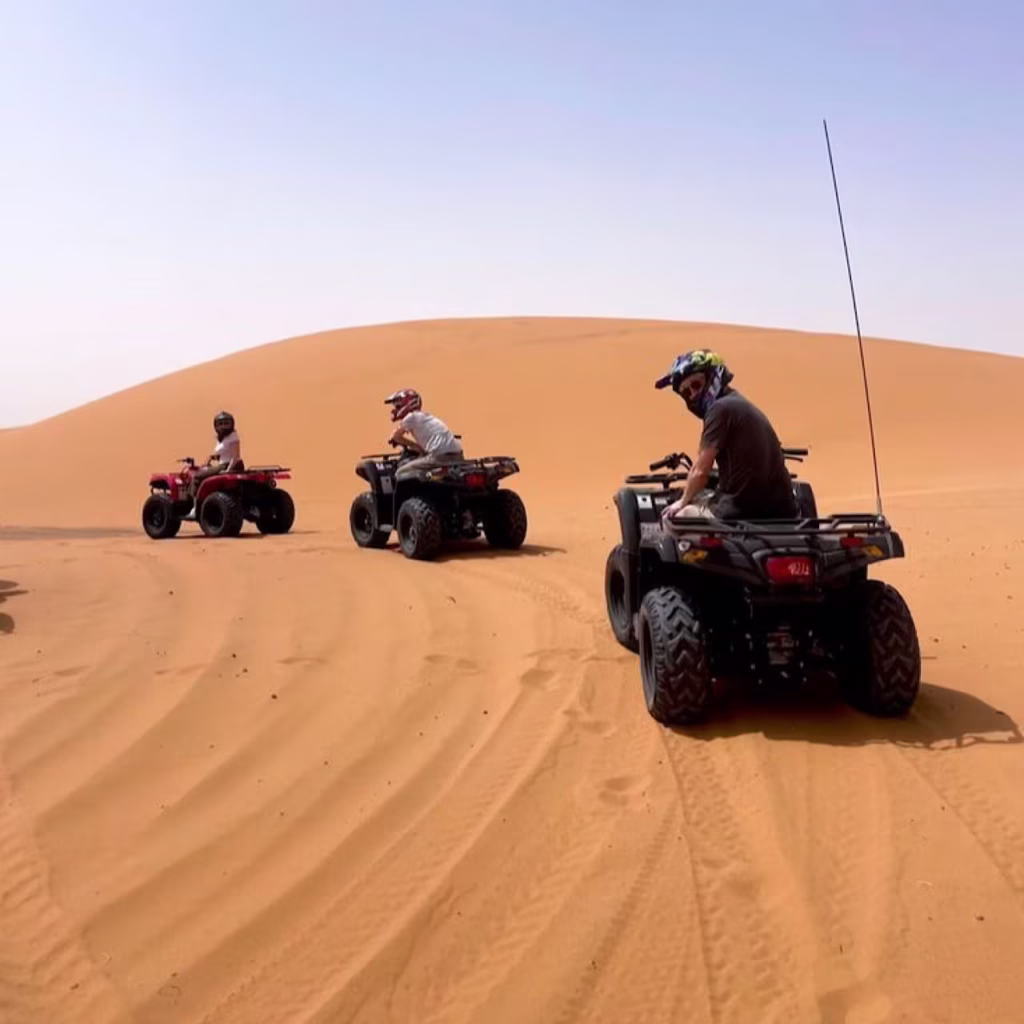 Group on an Agadir quad bike tour exploring the dunes