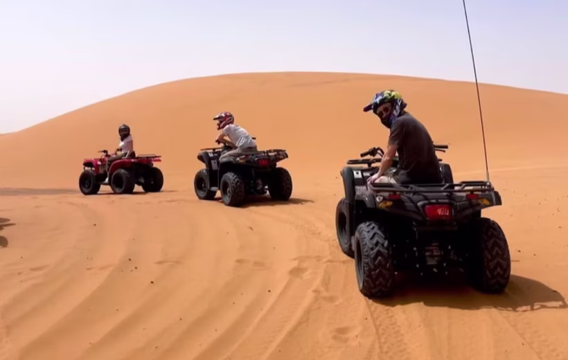 Group on an Agadir quad bike tour exploring the dunes