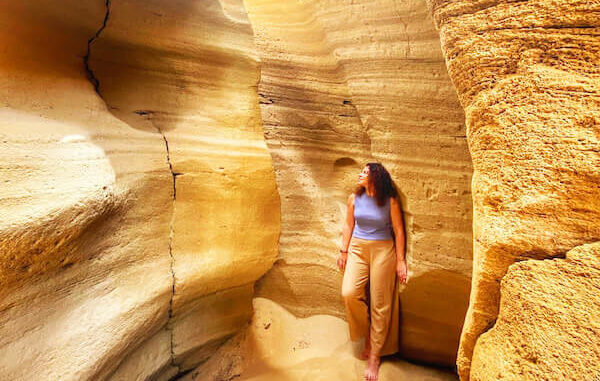 Sandboarding down golden dunes near Agadir with stunning views of the Atlantic coastline and rolling desert landscapes.