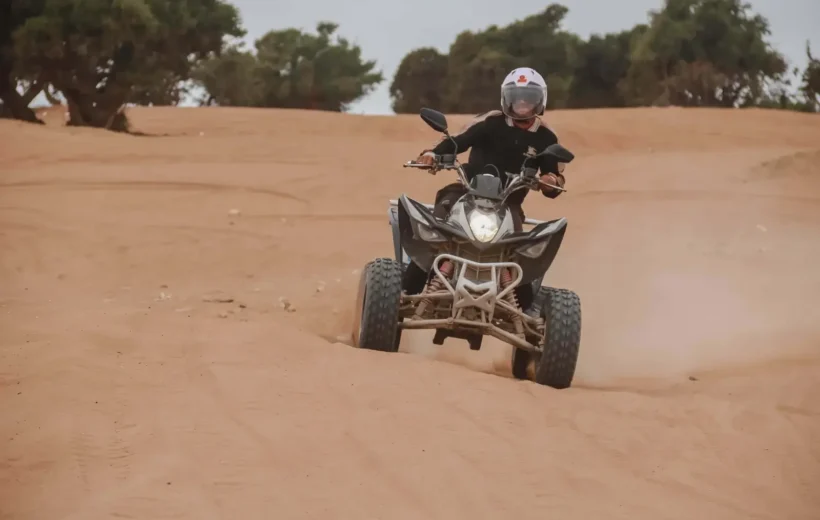 Quad bikes parked on sand dunes overlooking the Atlantic