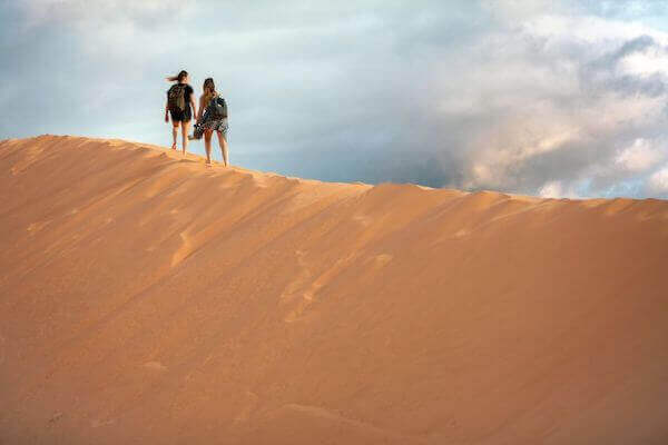 Golden Timlalin sand dunes under blue sky near Agadir