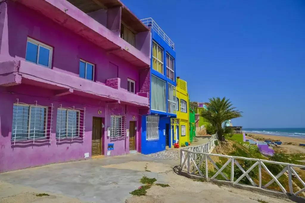 Travellers exploring Aghroud Village near Agadir during the sandboarding excursion from Marrakech.