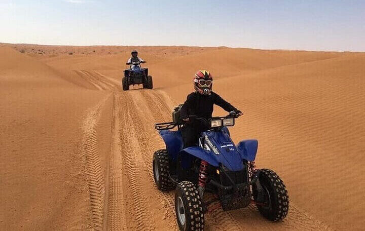 Group on an Anza quad bike tour exploring the dunes