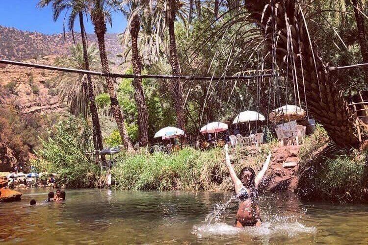 Tourists enjoying the natural pools in Paradise Valley