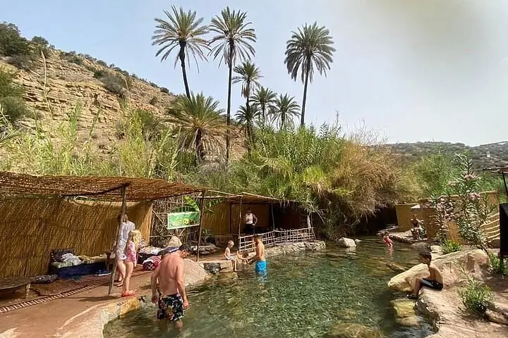 Tourists enjoying the natural pools in Paradise Valley