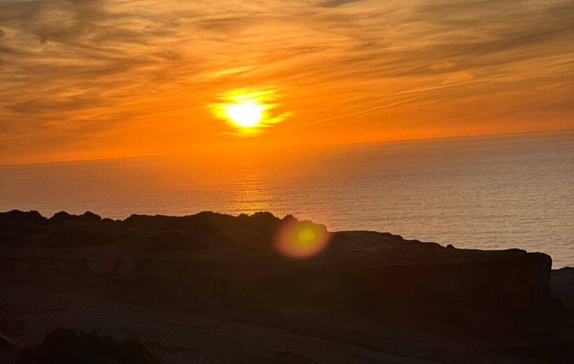 Sunset over desert dunes during Agadir desert trip