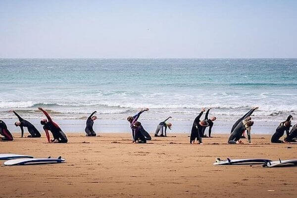 Surf instructor teaching a private lesson near Agadir